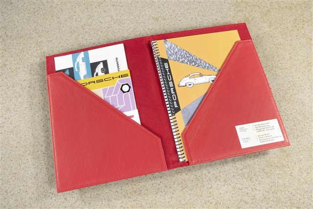 Leather Document wallet in Red with embossed Porsche logo for the storage of the service booklet and the Driver's manuals.